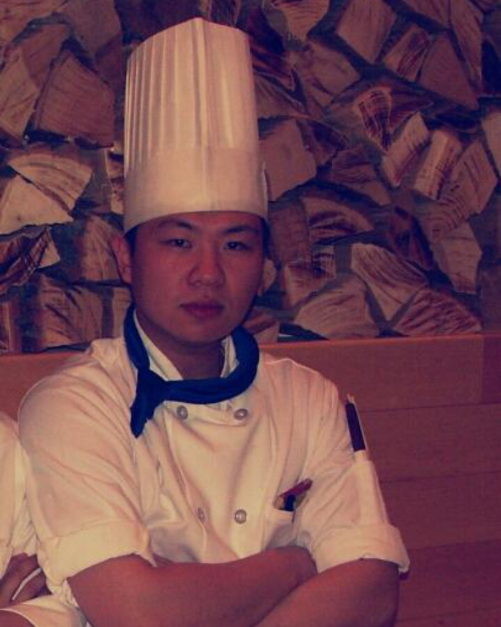 Chef in whites during culinary training in Japan