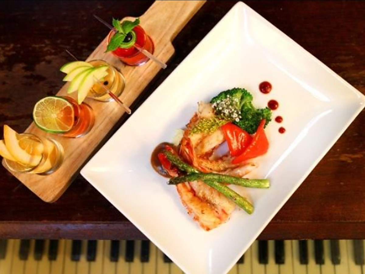 Plated dish served on a piano-side counter